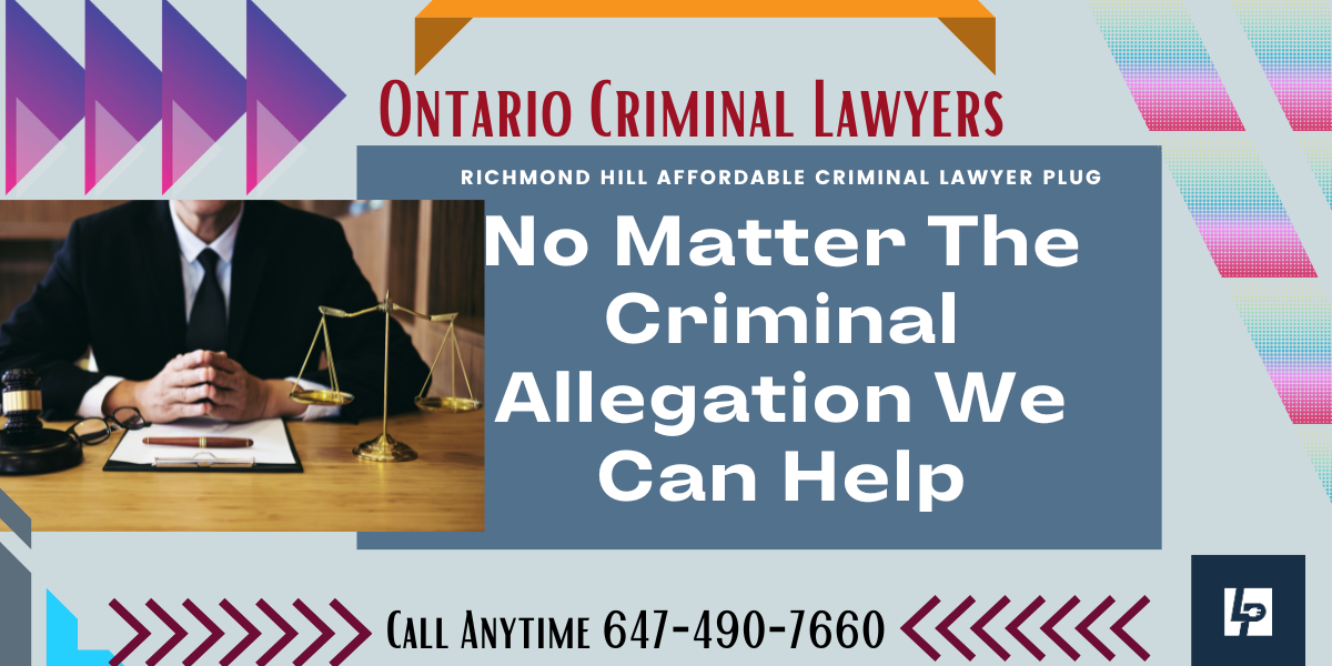 Ontario Criminal Lawyer sitting at a desk.