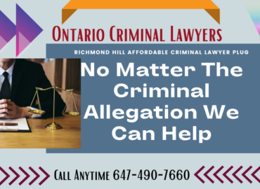 Ontario Criminal Lawyer sitting at a desk.