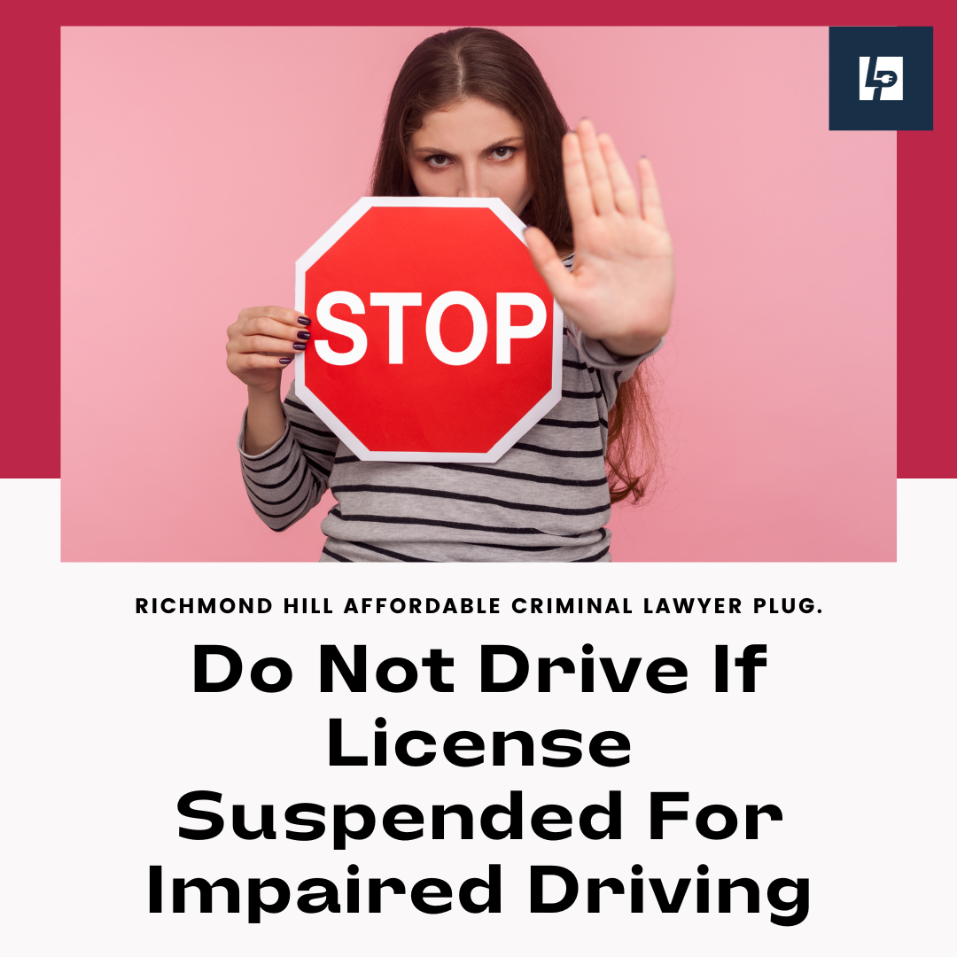 Woman holding a stop sign saying do not drive if license suspended for Impaired Driving say a Brampton DUI Lawyer